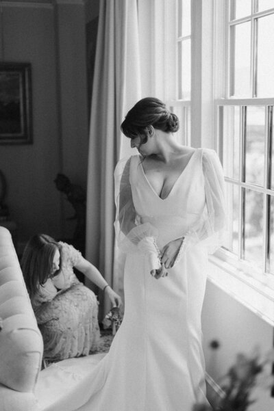 Bride elegantly posing with her veil during a New York City wedding