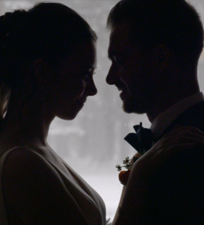 Black and white photo of a couple standing face to face