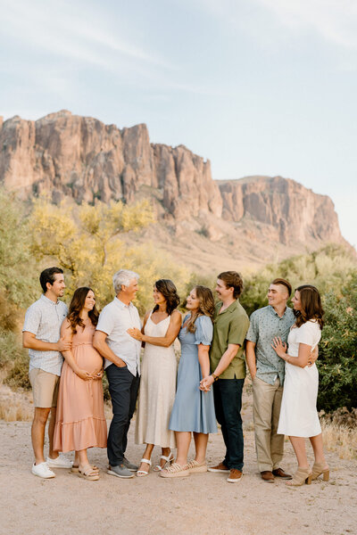 family of eight pose in arizona landscape