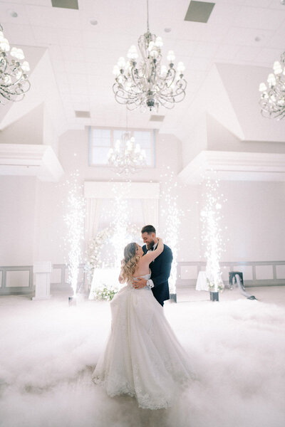 Bride and groom share magical first dance with sparklers and fog effect at Deer Creek in Ajax, Ontario, captured by a Toronto wedding photographer