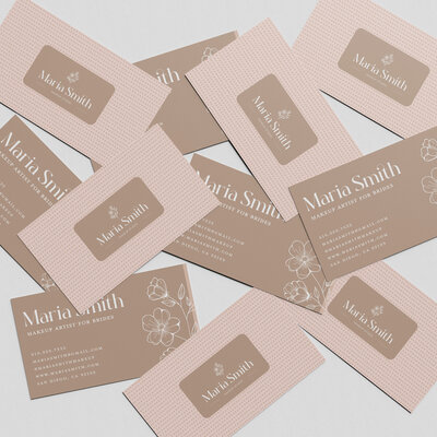 Minimalist business card design for a bridal makeup artist with delicate script typography and a soft glam aesthetic.