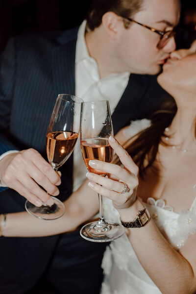 couple share a glass of champagne