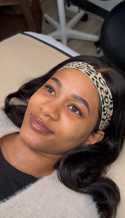 This image features a real client after receiving a Signature Brow sculpting and Classic Lash Extension service at Book Sothana, a boutique day spa located at 9303 Baymeadows Rd 105, #120, Jacksonville, FL 32256. Licensed esthetician Sothana specializes in creating natural-looking, symmetrical brows and soft, enhanced lashes that elevate the client’s natural beauty. Jacksonville clients trust Book Sothana for personalized beauty services that blend expert technique with intentional care. Every brow and lash service is customized to frame the face beautifully while maintaining a lightweight, effortless feel. Whether you are preparing for a special occasion or simply want to enhance your everyday look, Book Sothana delivers results you’ll love. Schedule your Signature Brow and Classic Lash appointment today by calling (904) 597-0867 or visiting https://booksothana.com/. Discover the beauty of customized, expert beauty services at Jacksonville’s trusted destination—Book Sothana.