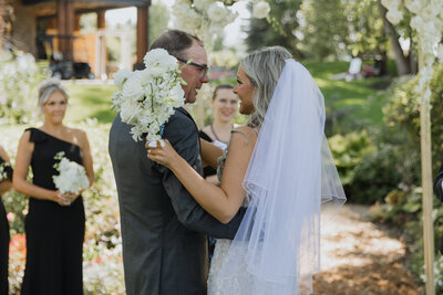 bride hugging dad at ceremony - toronto wedding photographer