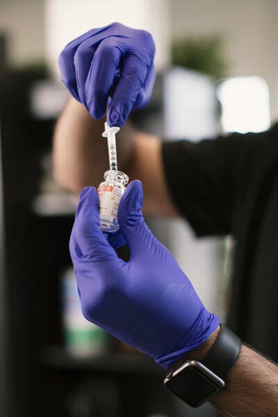 Dr. Naseer Syed consulting with a patient about Botox treatment in Fishers, Indiana