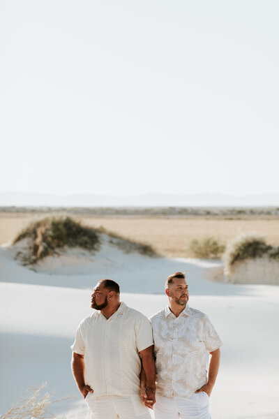 two men holding hands