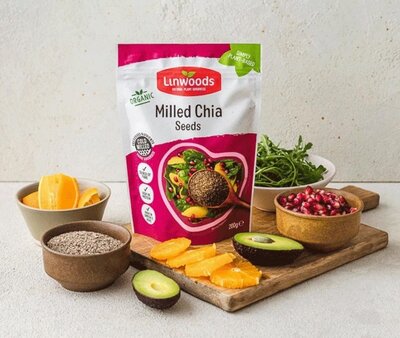 Linwoods milled chia seeds pouch with avocado and oranges – a plant-based pantry staple for hormone balance.