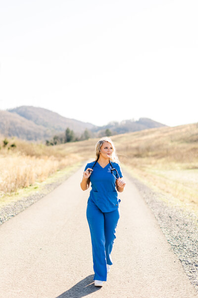 a young woman posing in nursing scrubs