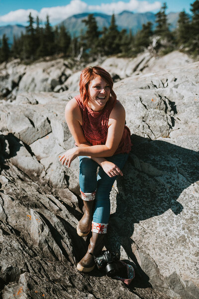 ATP aka Allison sitting on some rocks in Alaska