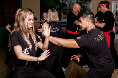 Instructors interacting in various poses Zen Wellness team