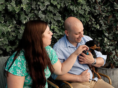 engaged couple with their pet dog