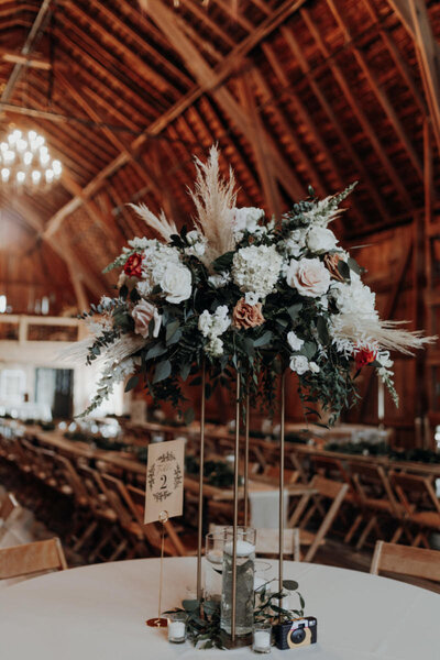 Tall floral centerpiece at wedding reception