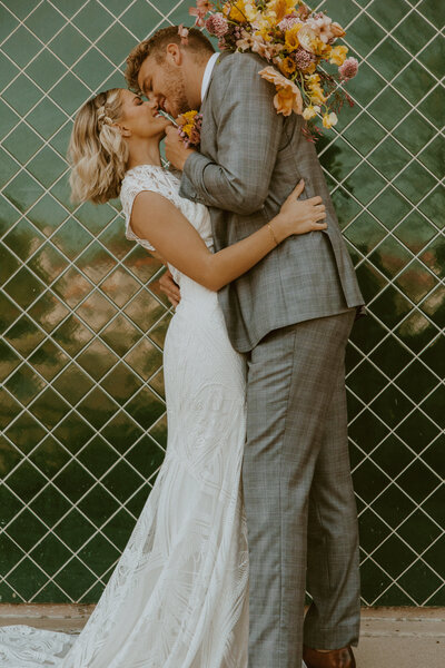 Bride and groom almost kissing