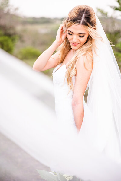Bride having fun in the countryside at the Terrace Club in Dripping Springs, Texas/