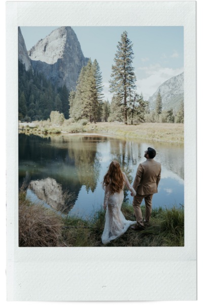 bride reads vows to groom while groom smiles at bride in Yosemite the photo is in a polaroid frame