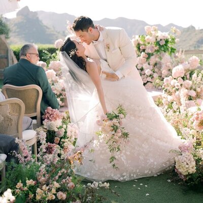 Kohnur couple portrait with bride in natural glowing makeup and romantic updo, wearing a sheer gown in California Estate Wedding