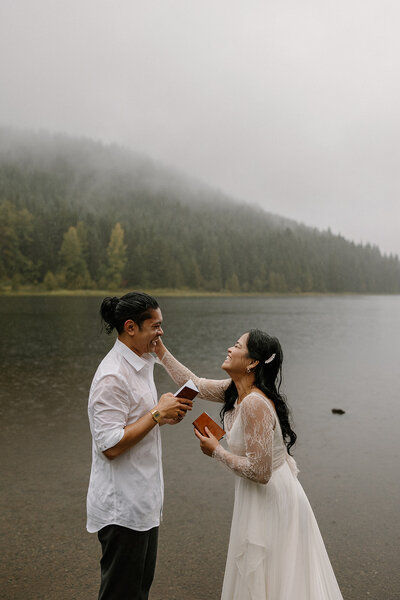 Bride wipes her grooms tears during their heartfelt vows.