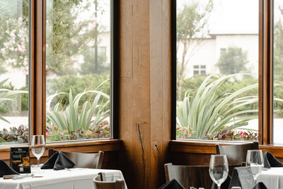 tall windows and wood panel wall in restaurant interior
