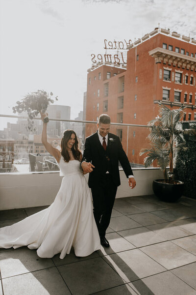 bride and groom celebrate after wedding ceremony in san diego