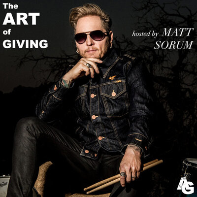 Matt Sorum portrait The ART of GIVING instagram feed hand to his chin holding drumsticks in other
