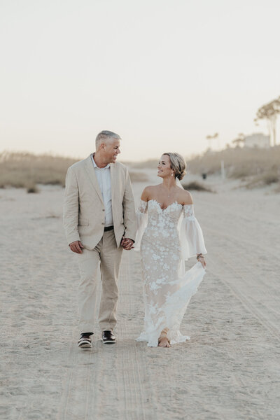 bride and groom on the beach at palmetto dunes wedding