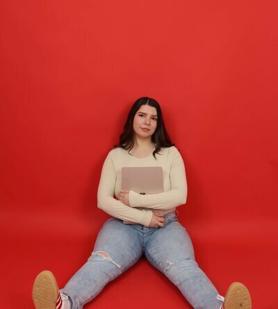 Social Media Agency Houston Founder Kayla Sitting on Floor