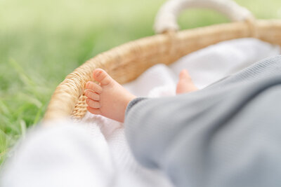 baby feet during lifestyle newborn picture in Leesburg, VA