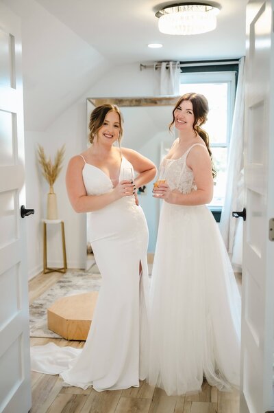 bride looking in mirror while trying on dress