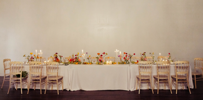 Elegant wedding reception table with floral centerpieces and minimalist design
