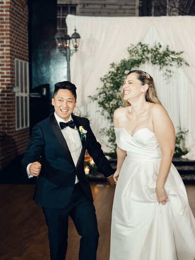 Couple smiling and cheering in DC wedding taken by wedding photographers in washington dc