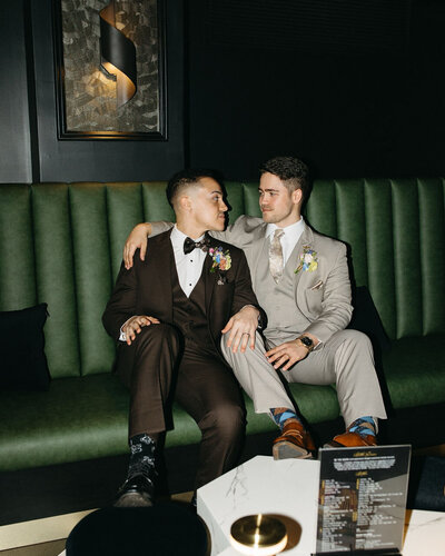 Photographer and his husband smiling together on their intimate elopement day in New York City