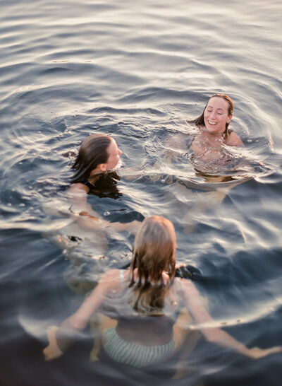 women swimming in lake in madison wisconsin small business retreat