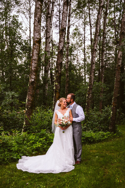 Bride and groom standing in the forest - Nevis, Minnesota