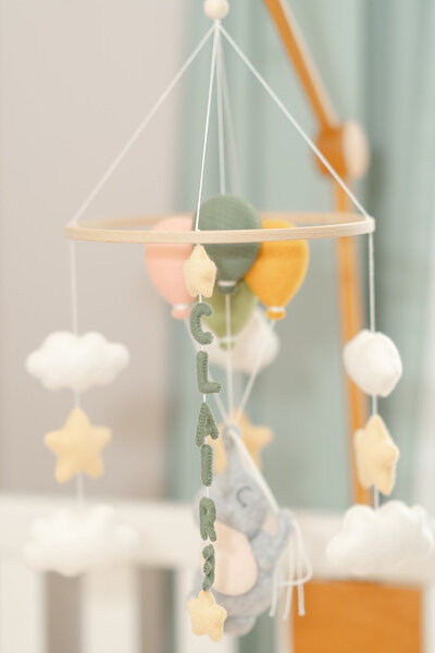 custom baby mobile during product photography in South Riding,VA