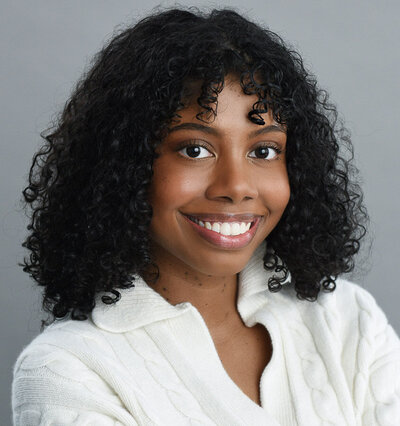 Headshot of young female headshots  of psychologist with professional lighting