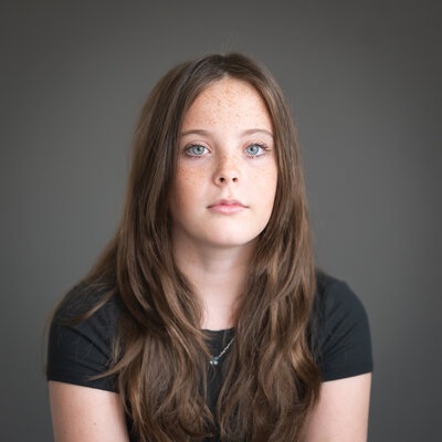 10 year old girl performing art headshot serious face