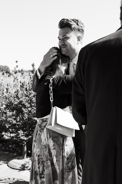 Get framed photography wedding photograpy caputre real moments - groom hugs mom