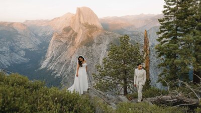 bride and groom in mountains at sunset
