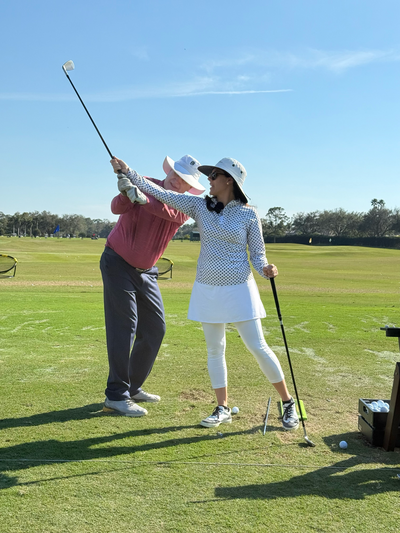 Renee O’Higgins, PGA and LPGA golf instructor giving a golf lesson at Quail West in Naples, Florida.