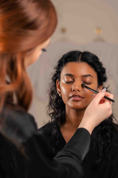 women getting makeup styled