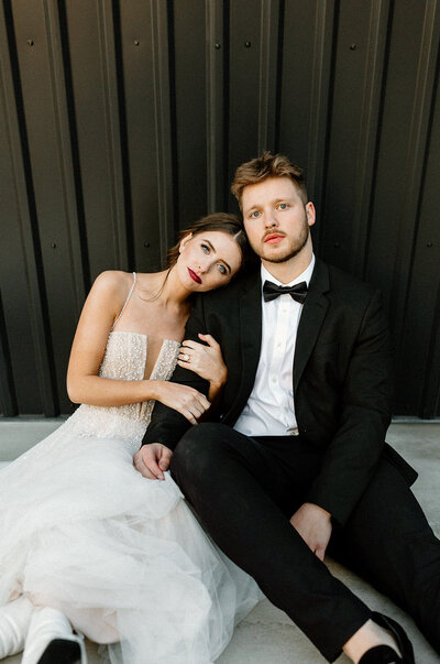 bride and groom snuggling on wedding day