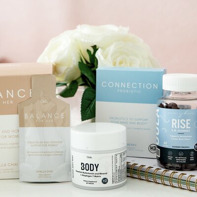 Oola supplement collection for body balance connection and rise with white flowers 