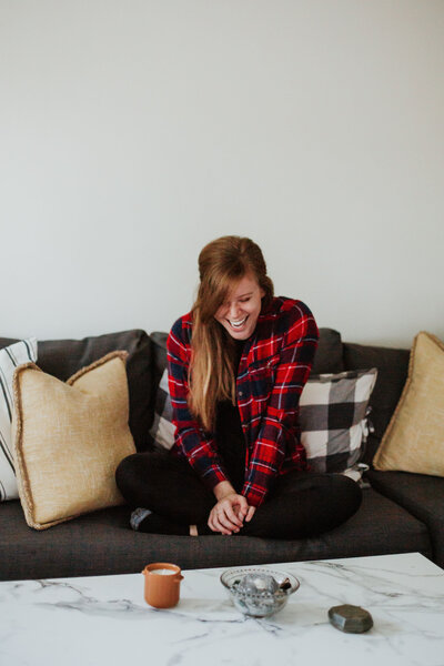 Ashley Mondor couch smiling