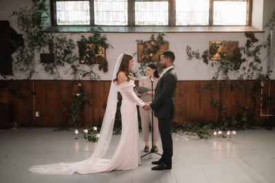 This breathtaking wedding at AllSaints Event Venue blends organic elements with modern, high fashion influences. Captured by Danielle Meredith Photography, the couple's chic style is evident in every detail, from the elegant floral arrangements to the sophisticated attire. The venue's contemporary design provides a stunning backdrop for the ceremony and reception, creating a seamless blend of natural beauty and high-end fashion. Keywords: organic wedding, modern wedding, high fashion wedding, AllSaints Event Venue, Danielle Meredith Photography, wedding photography, elegant wedding, contemporary wedding design.