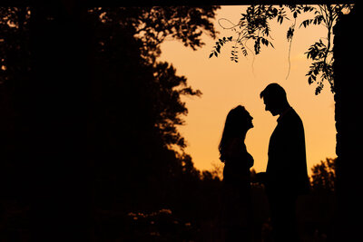 Sayen House & Gardens | Couple under string lights during summer engagement photo | Hamilton Township, New Jersey