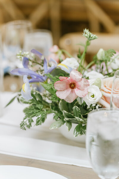 arbor with white flowers and table