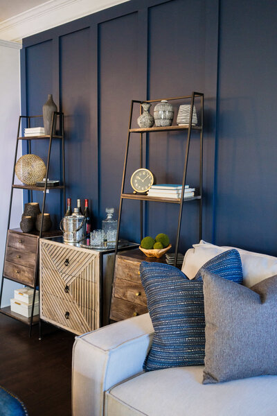 a living room with a blue accent wall