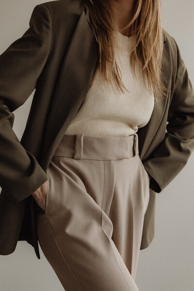 business woman with hands in pockets