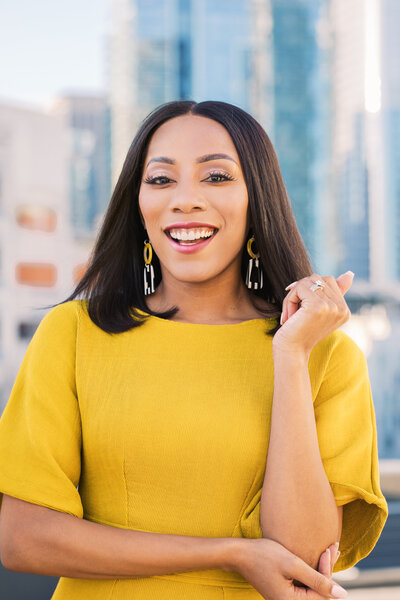 Woman business owner smiling in the city