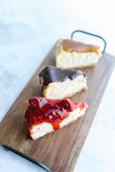 trio of cheesecakes on serving board